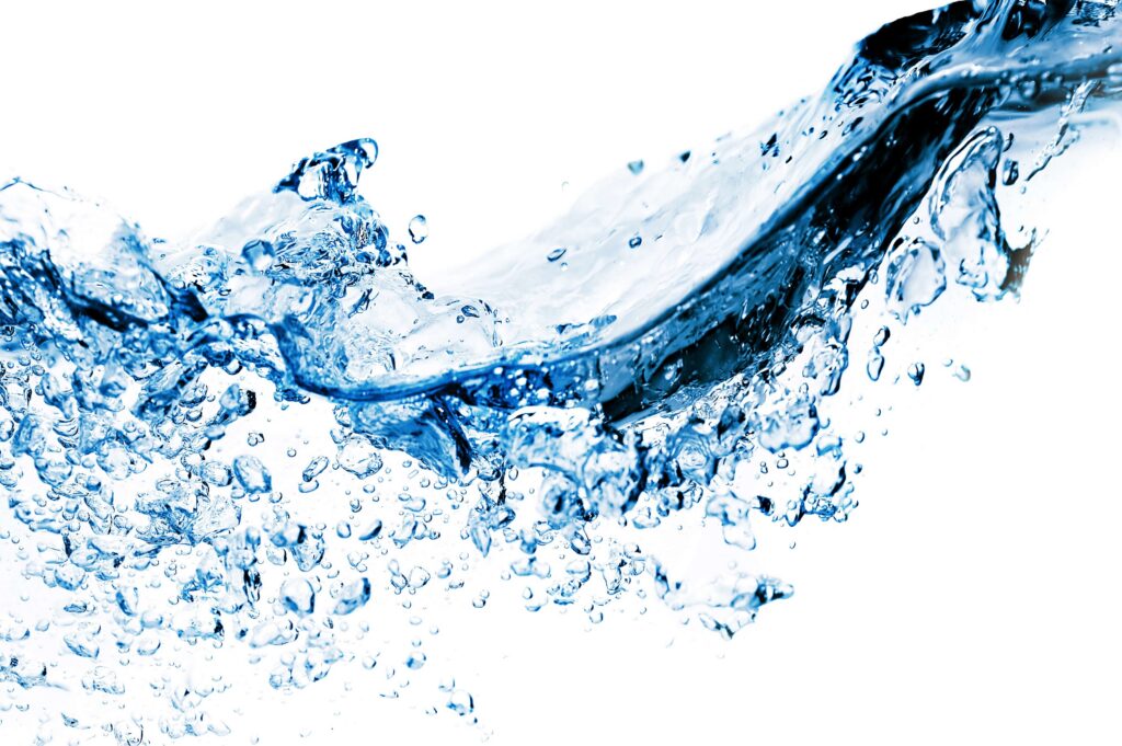 Clear, flowing water splashing in motion, representing clean, filtered drinking water and water purification quality.