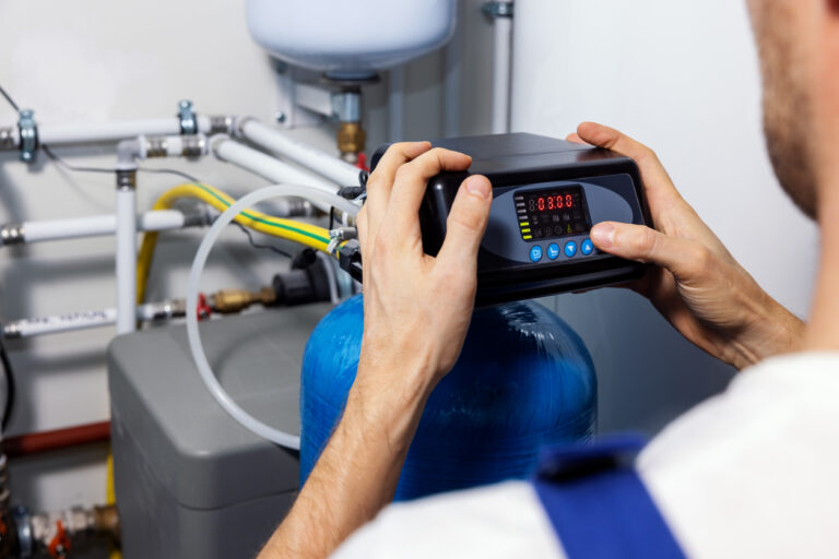 worker set up house water purification and filtration system