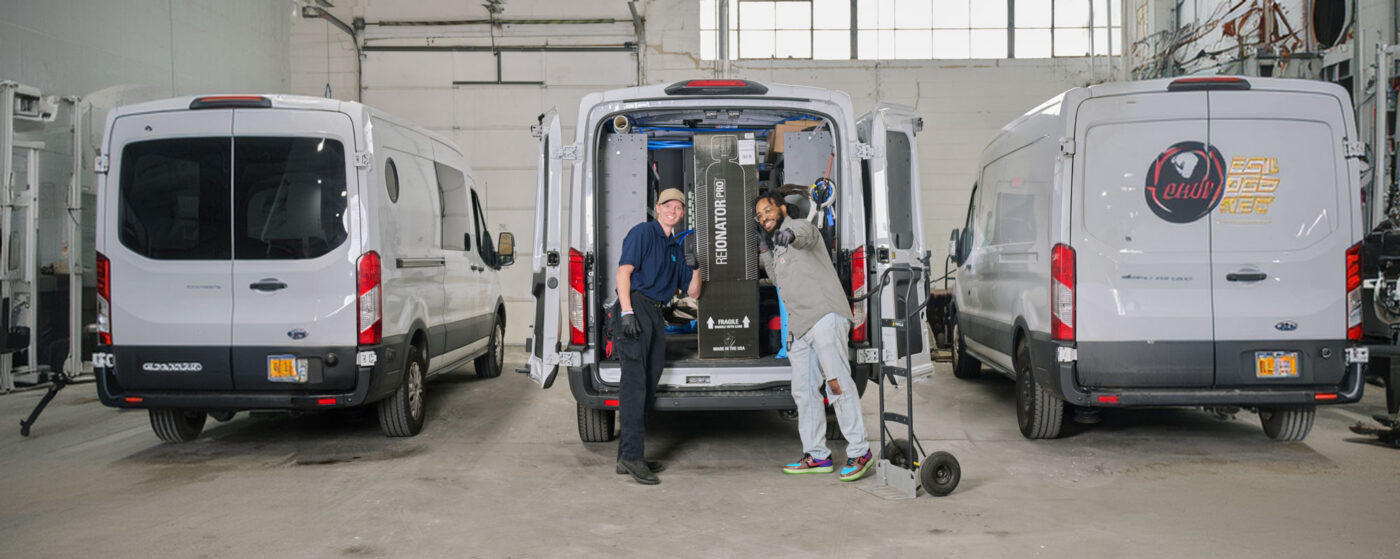 image of techs by their service vehicle